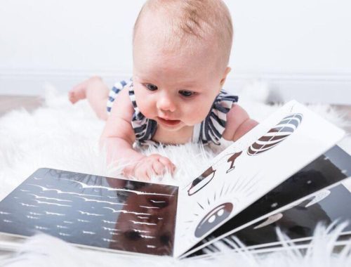 Baby reading black and white book